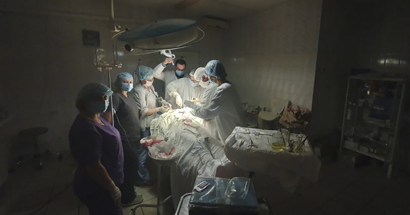 This photo made available by Ukrainian doctor Oleh Duda shows the moment when lights at a hospital went out as he was performing complicated, dangerous surgery on a bleeding patient at a hospital in Lviv, Ukraine, on Nov. 15.