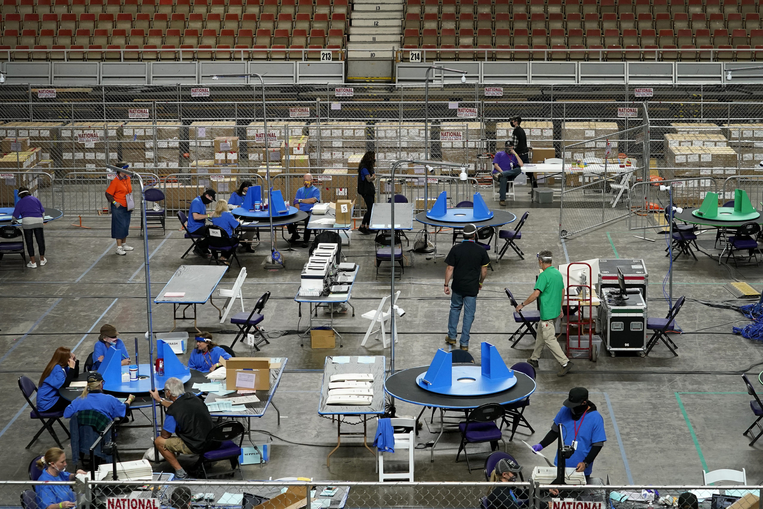 Maricopa County, Ariz., ballots cast in the 2020 general election are examined and recounted by contractors working for Florida-based company, Cyber Ninjas, in Phoenix in this file photo from May 6, 2021. At least one recount will be on tap in Arizona after the counting from the Nov. 8 midterm elections ends.