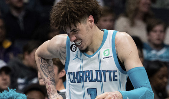 Charlotte Hornets guard LaMelo Ball reacts after being shaken up on a play during the second half of the team's NBA basketball game against the Indiana Pacers in Charlotte, North Carolina, on Wednesday.