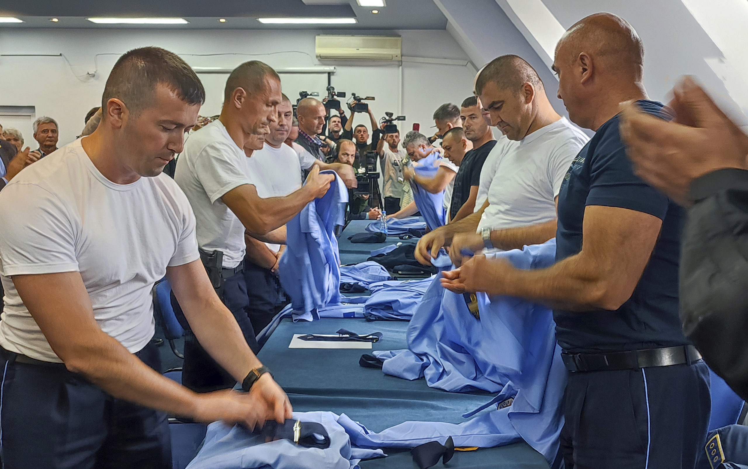 Serb police officers took off their uniforms after a a mass resignation in the town of Zvecan, Kosovo, on Saturday.
