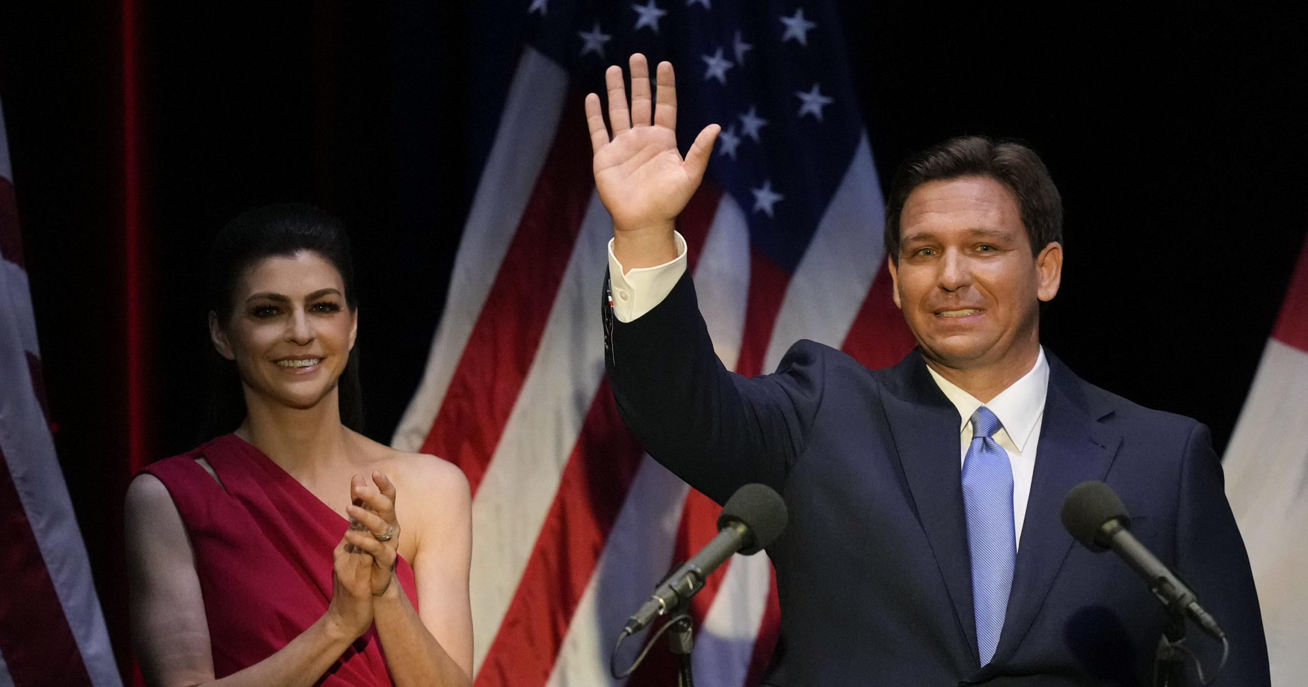 Florida's Republican Gov. Ron DeSantis waves as his wife Casey applauds following a televised debate against Democratic opponent Charlie Crist in Fort Pierce, Florida, on Oct. 24.