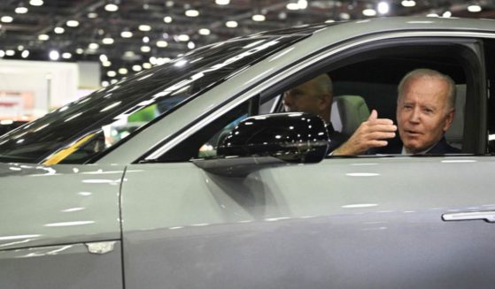 President Joe Biden sits behind the wheel of a Cadillac Lyriq electric vehicle as he visits the North American International Auto Show in Detroit on Sept. 14.