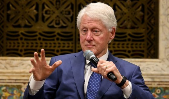 Former President Bill Clinton, seen at a Nov. 10 event, announced on Twitter that he has tested positive for COVID-19.