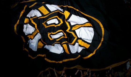 A Boston Bruins flag is passed over the crowd during introductions for Game Three of the 2013 NHL Stanley Cup Final between the Chicago Blackhawks and the Boston Bruins at TD Garden in Boston, Massachusetts, on June 17, 2013.