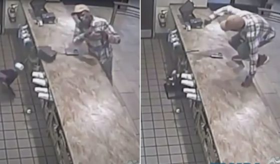 Surveillance video shows the man knocking a cash register to the floor, then jumping the counter.