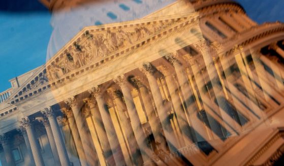 The Supreme Court is seen through a reflection of the U.S. Capitol dome in Washington, D.C., on Tuesday.