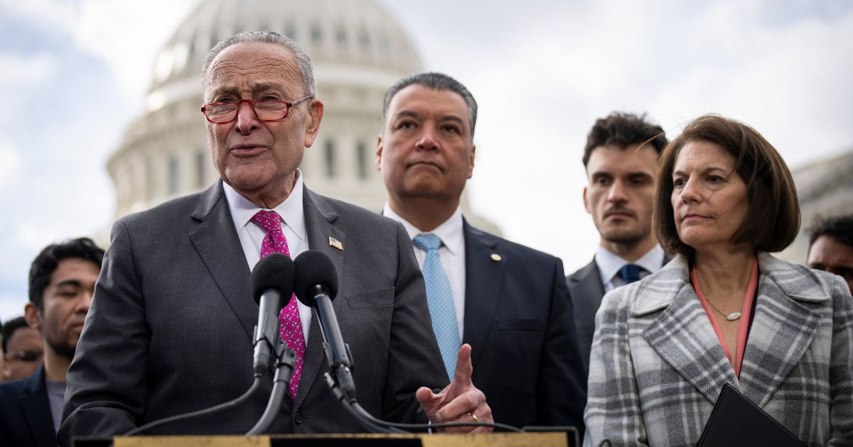 Senate Majority Leader Chuck Schumer, left, speaks during a news conference outside the U.S. Capitol on Nov. 16 in Washington, D.C.