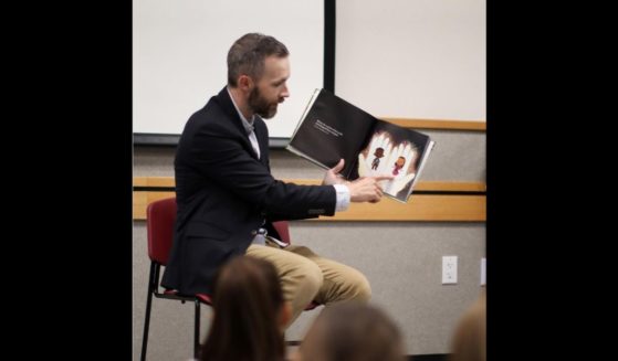 Pastor Dale Partridge of Prescott, Arizona, reads his book "Jesus and My Gender" to children at a local library.