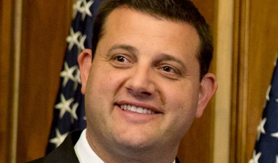 Republican Rep. David Valadao of California poses during a ceremonial re-enactment of his swearing-in ceremony in the Rayburn Room on Capitol Hill in Washington on Jan. 6, 2015.