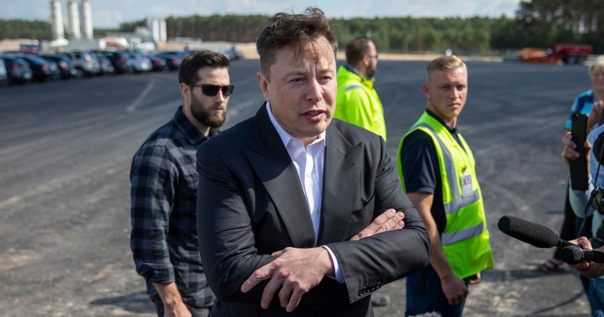 Twitter CEO Elon Musk talking to reporters