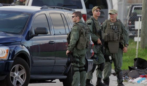 FBI agents conduct what is being reported as a terrorism-related investigation on June 22, 2006 in Miami.
