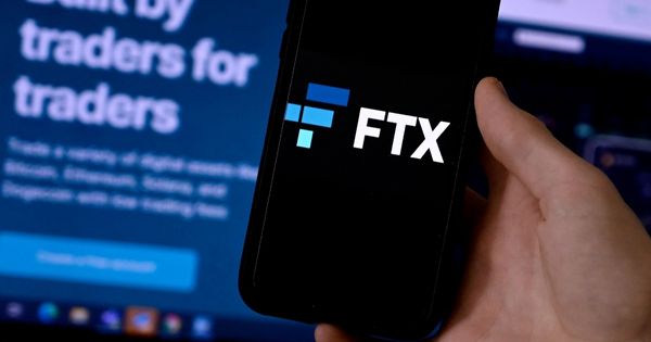 The FTX logo is displayed on a smart phone screen with the FTX website shown in the background.