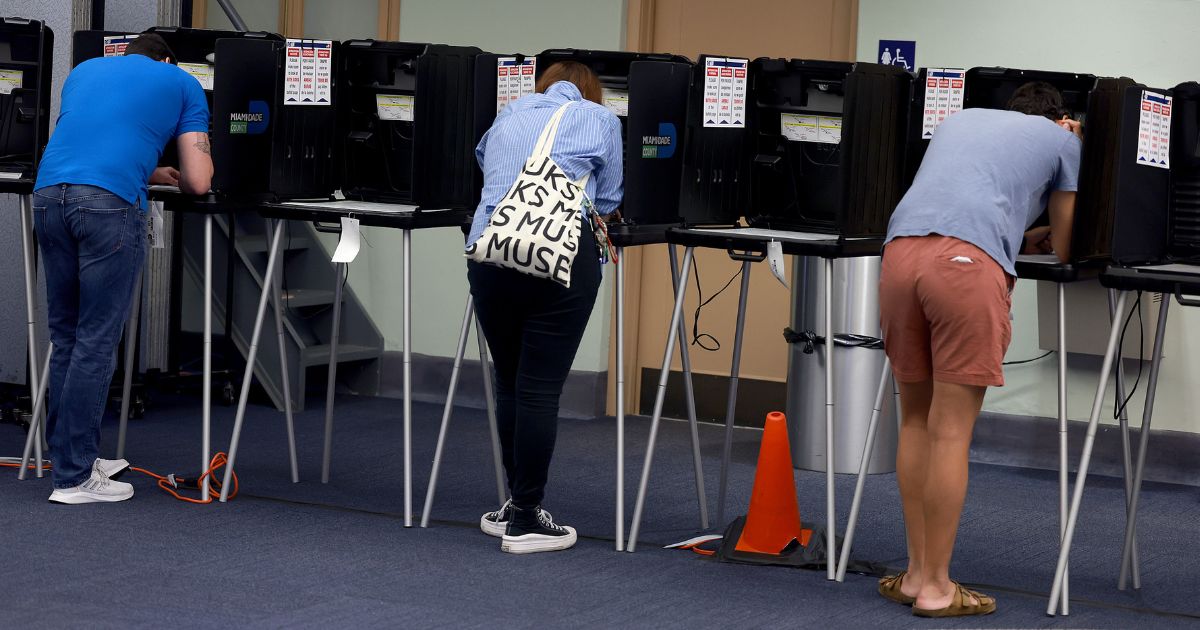 Voters cast their ballots at a polling station in Miami on Tuesday.