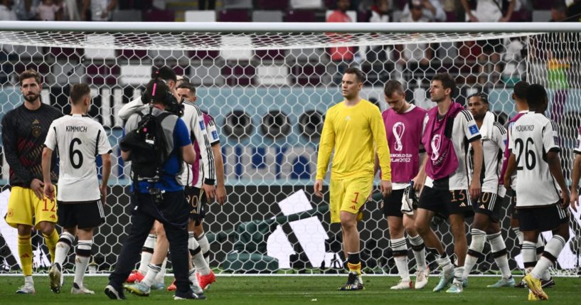 German goalkeeper Manuel Neuer, center, and his teammates react after losing 2-1 to Japan in the World Cup Group E football match at the Khalifa International Stadium in Doha, Qatar, on Wednesday.