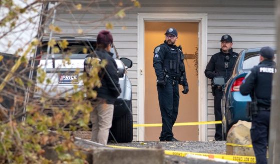 Officers investigate a homicide at an apartment complex south of the University of Idaho campus on Nov. 13.