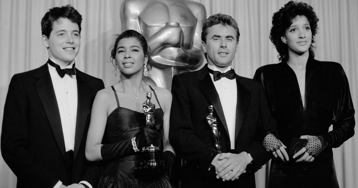 Best Song Winners for 'Flashdance' Irene Cara and Keith Forsey (center), with presenters Mathew Broderick, and Jennifer Beals backstage at the 56th Annual Academy Awards Show, April 9, 1984 in Los Angeles.