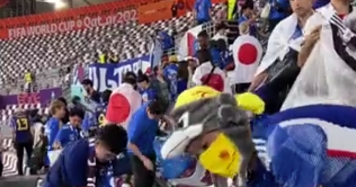 Japanese World Cup fans help clean up after an upset win over Germany.