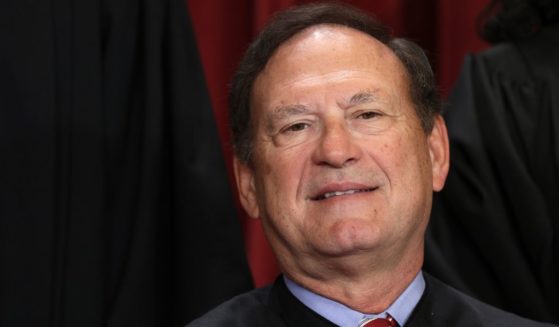 Justice Samuel Alito poses for an official portrait in the East Conference Room of the Supreme Court building in Washington on Oct. 7.