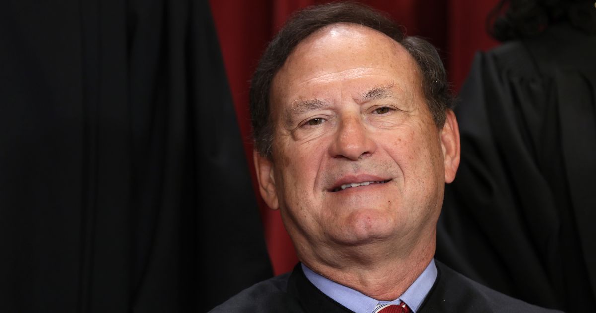 Justice Samuel Alito poses for an official portrait in the East Conference Room of the Supreme Court building in Washington on Oct. 7.