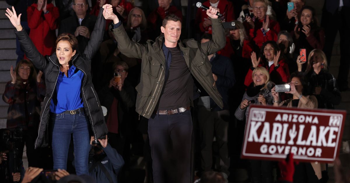 Kari Lake and Blake Masters appear at a campaign rally on Monday in Prescott, Arizona.