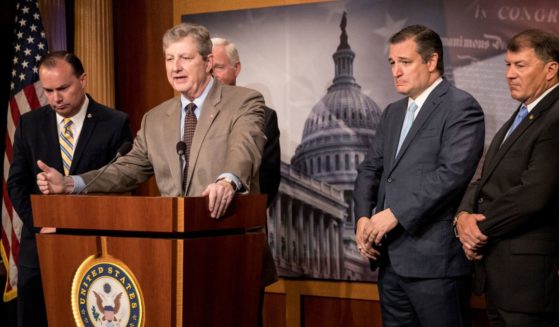 Republican Sen. John Kennedy of Louisiana speaks while other senators look on during a news conference at the U.S. Capitol in Washington on June 19, 2018.