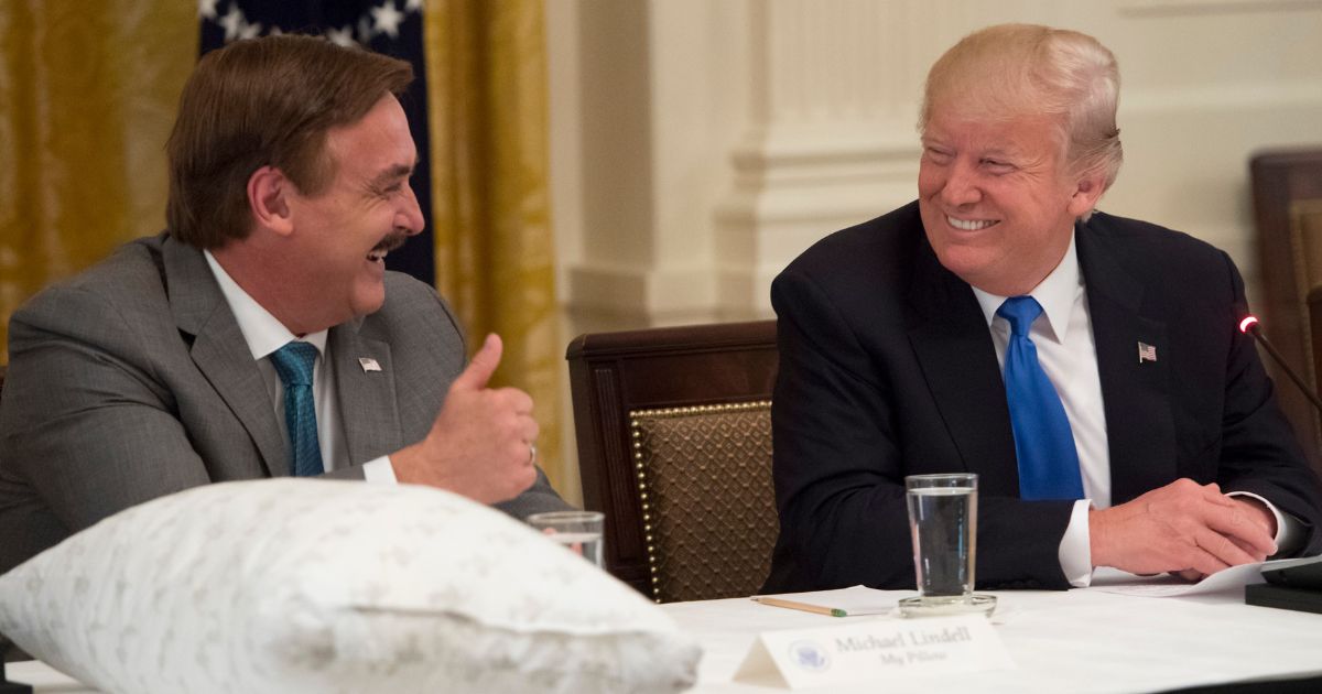 MyPillow founder Mike Lindell, left, speaks with then-President Donald Trump during an event with American manufacturers in the East Room of the White House in Washington on July 19, 2017.
