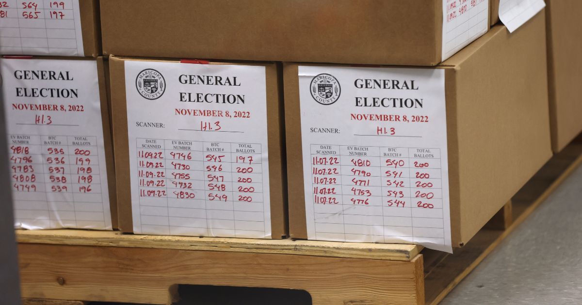 Boxes of scanned ballots sit on a pallet at the Maricopa County Tabulation and Election Center in Phoenix on Nov. 9.