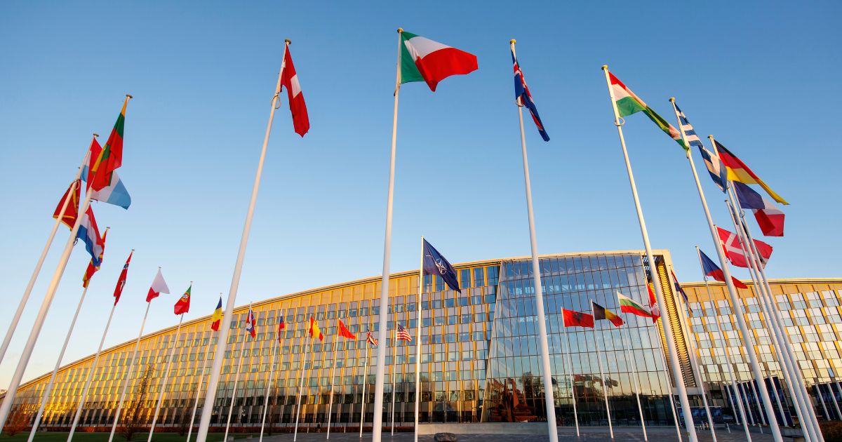 Flags of NATO members fly outside the NATO headquarters in Brussels, Belgium, on Wednesday.