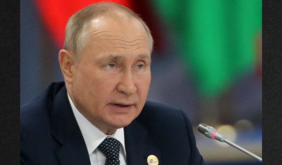 Russian President Vladimir Putin is seen in a file photo from October. A new report quotes an anonymous intelligence official as saying Putin is battling two serious illnesses.