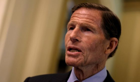 Democratic Sen. Richard Blumenthal of Connecticut speaks with a reporter before going to a luncheon with Senate Democrats in Washington, D.C., on June 14.