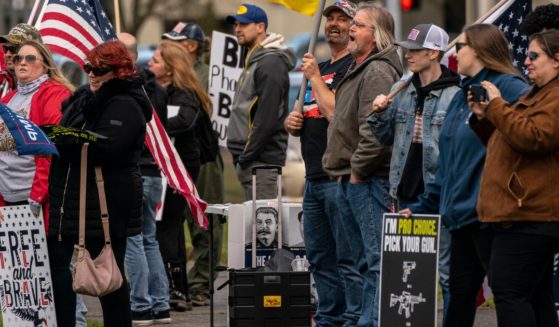 A group of demonstrators hold a Second Amendment rally at the Washington State Capitol in Olympia, Washington, March 20, 2021.