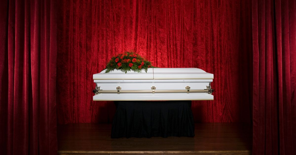 This stock photo shows a coffin on stage.