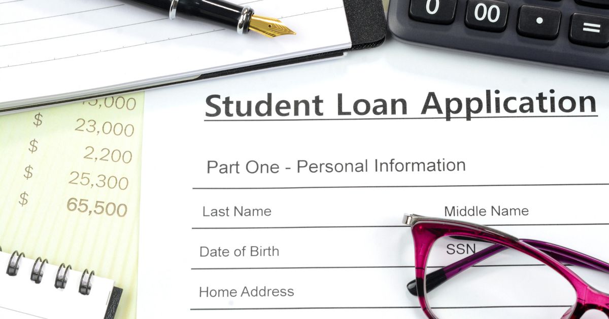 This stock photo shows a student loan application being prepared.