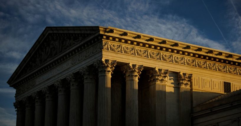 The rising sun creeps across the Supreme Court on Nov. 8 in Washington, D.C.