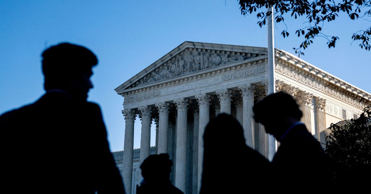 People wait in line outside the Supreme Court in Washington, D.C., on Oct. 11.