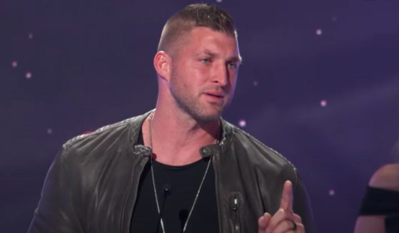 Tim Tebow speaks on stage after receiving the Sports Impact Award at the K-LOVE Fan Awards in Nashville, Tennessee, on May 29.