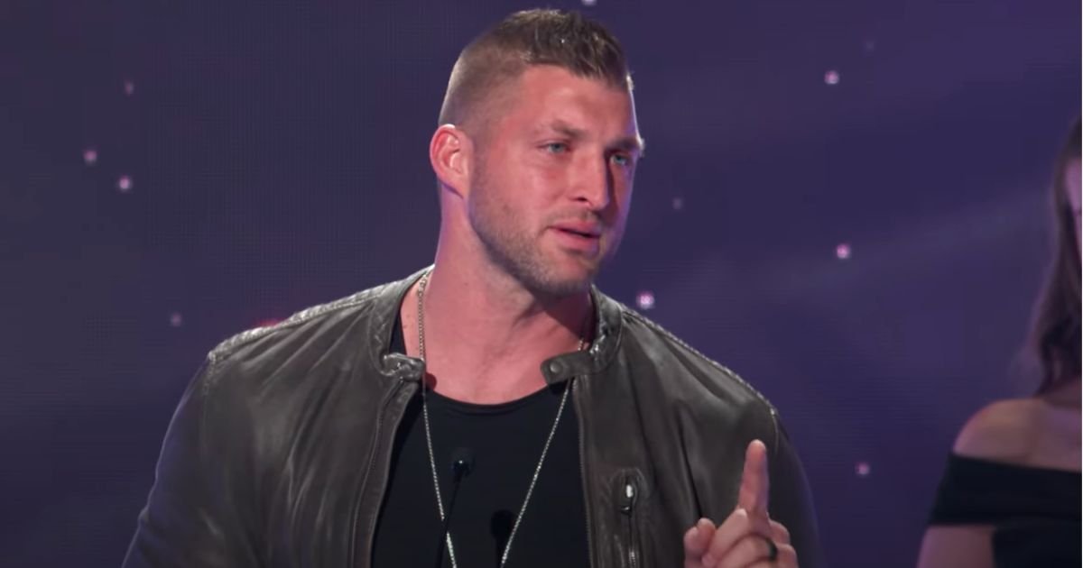 Tim Tebow speaks on stage after receiving the Sports Impact Award at the K-LOVE Fan Awards in Nashville, Tennessee, on May 29.