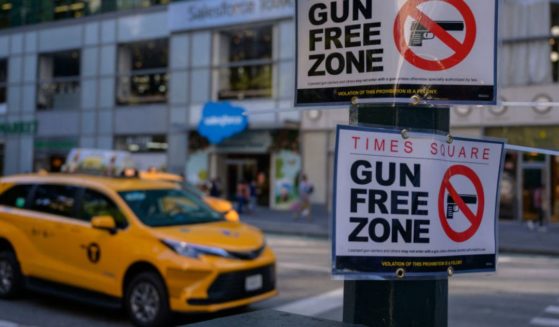 A "Gun Free Zone" sign is seen posted near Times Square in Manhattan on Sept. 1 in New York. A judge has temporarily suspended new state legislation governing concealed carry regulations across the state.