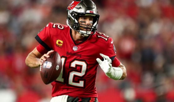 Tom Brady of the Tampa Bay Buccaneers drops back to pass during the fourth quarter of an NFL game against the Baltimore Ravens at Raymond James Stadium on Thursday in Tampa, Florida.