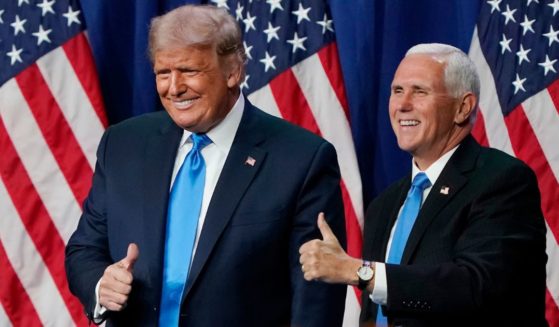 Donald Trump and Mike Pence, then the president and vice president, give a thumbs up after speaking on the first day of the Republican National Convention at the Charlotte Convention Center in Charlotte, North Carolina, on Aug. 24, 2020.