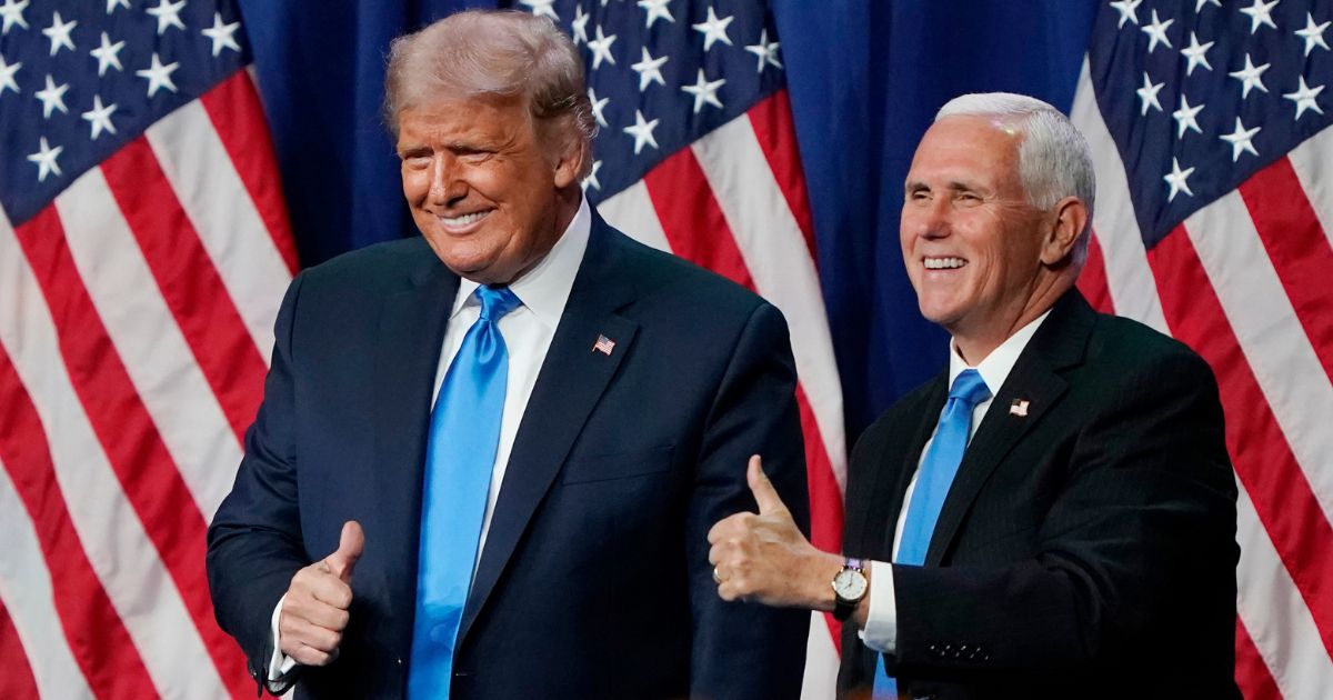 Donald Trump and Mike Pence, then the president and vice president, give a thumbs up after speaking on the first day of the Republican National Convention at the Charlotte Convention Center in Charlotte, North Carolina, on Aug. 24, 2020.