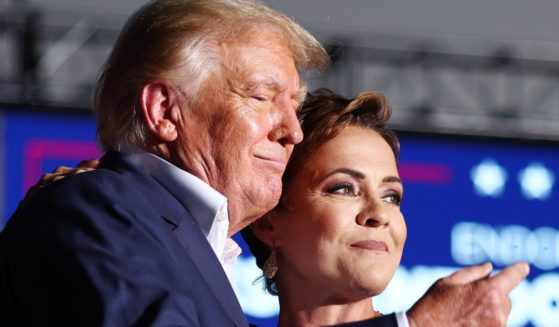 Former President Donald Trump and Arizona Republican Kari Lake, seen during an October campaign event, stirred speculation when they were seen together Thursday in Florida.