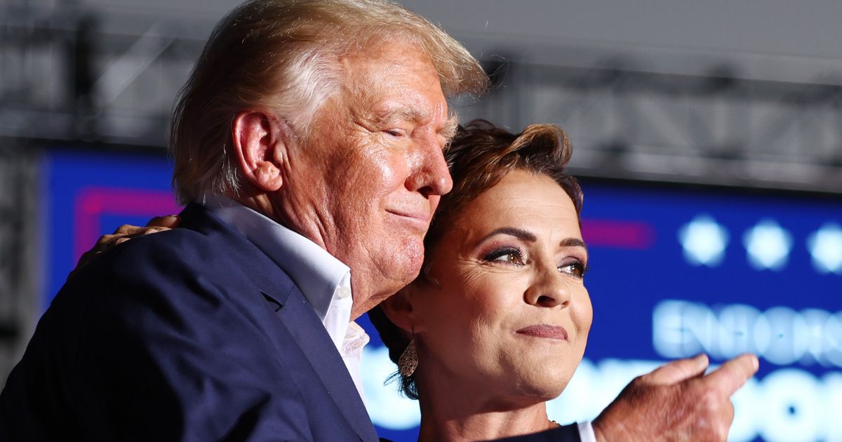 Former President Donald Trump and Arizona Republican Kari Lake, seen during an October campaign event, stirred speculation when they were seen together Thursday in Florida.