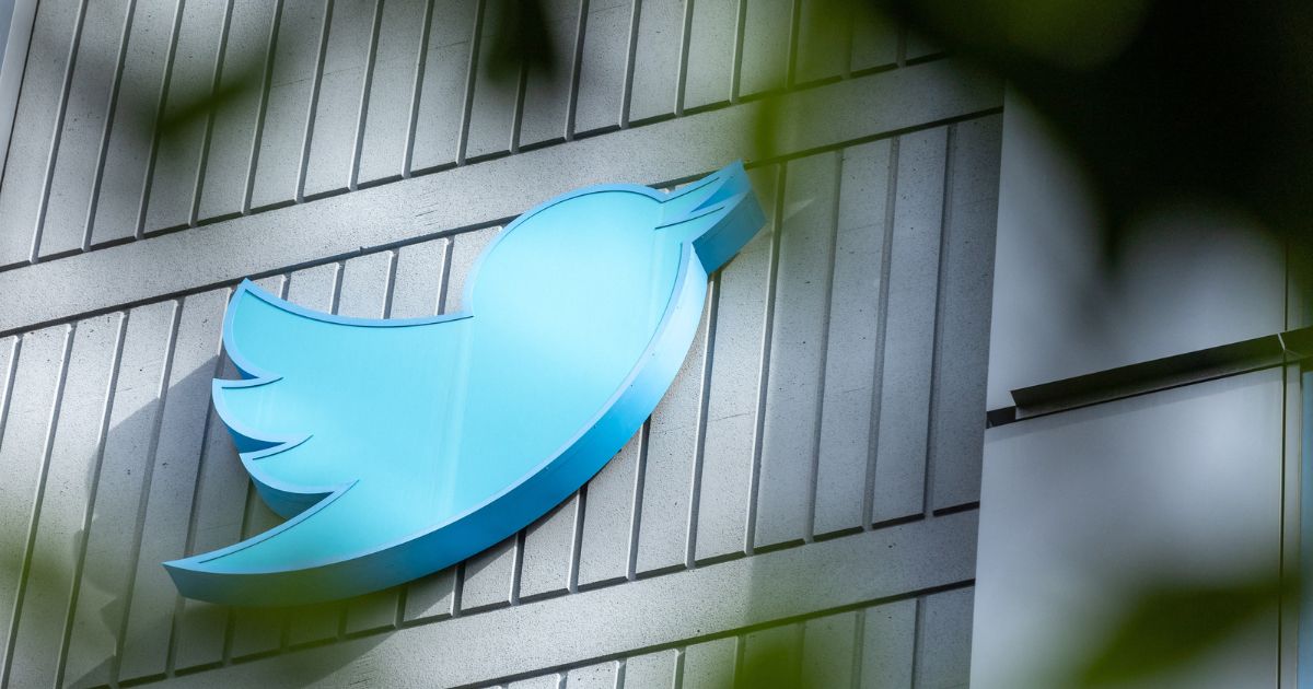 The Twitter logo is seen on a sign on the exterior of Twitter headquarters in San Francisco on Friday.