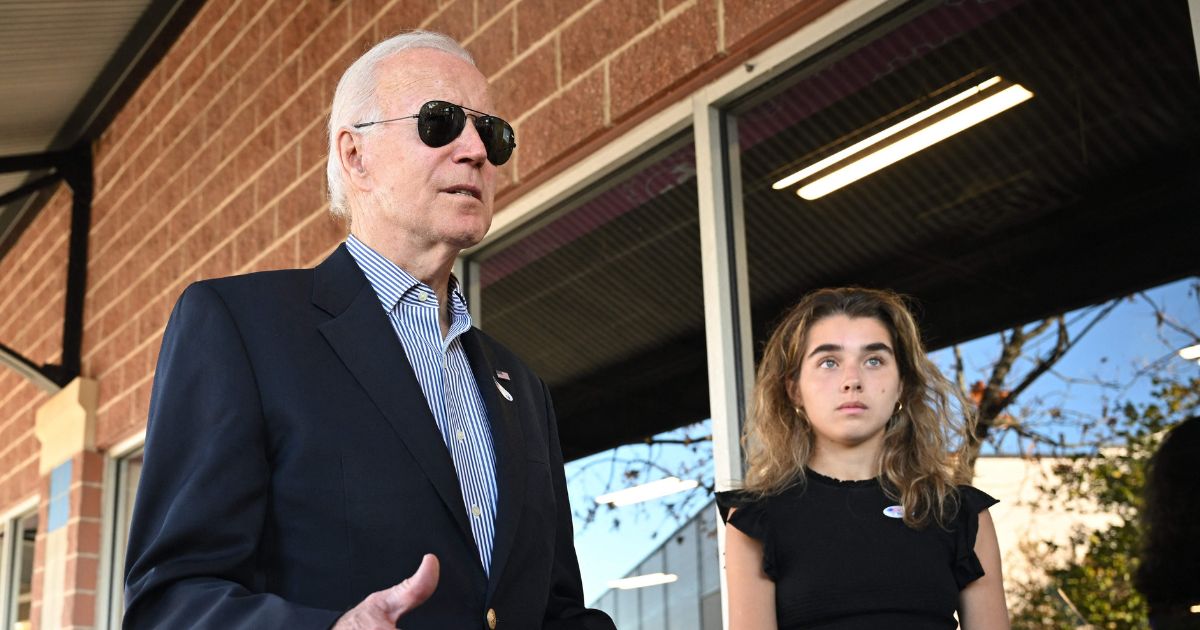 President Joe Biden, with his granddaughter Natalie Biden, speaks to the reporters after voting early in Wilmington, Delaware, on Saturday.