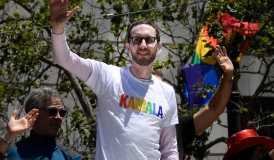 California state Sen. Scott Weiner, sporting a shirt supporting then-Sen. Kamala Harris' bid for the Democratic presidential nomination, rides in the San Francisco Pride Parade and Celebration in June 2019.