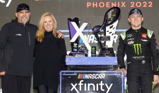 Coy Gibbs, left, Heather Gibbs and Ty Gibbs after Ty Gibbs won the Xfinity Series Championship on Saturday. Coy Gibbs died hours later.