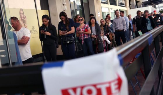 Voters wait to cast their ballots at the Biltmore Fashion Park in Phoenix, Arizona, on Tuesday.