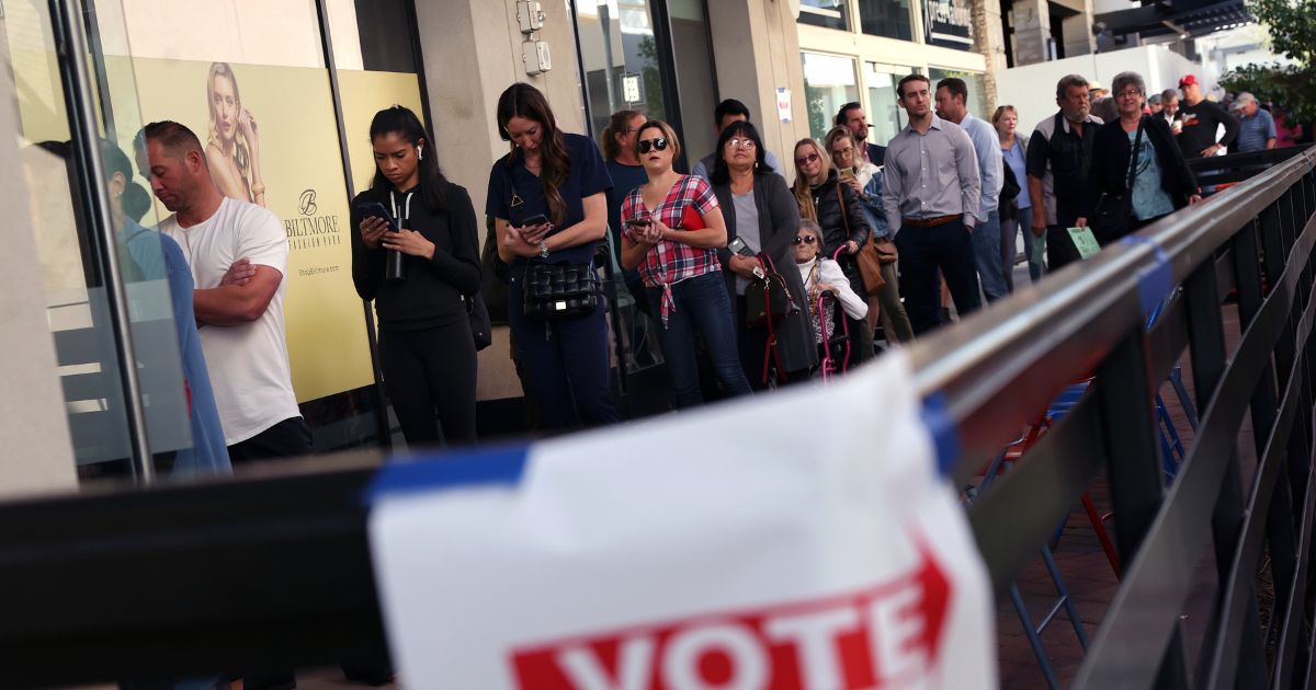 Voters wait to cast their ballots at the Biltmore Fashion Park in Phoenix, Arizona, on Tuesday.