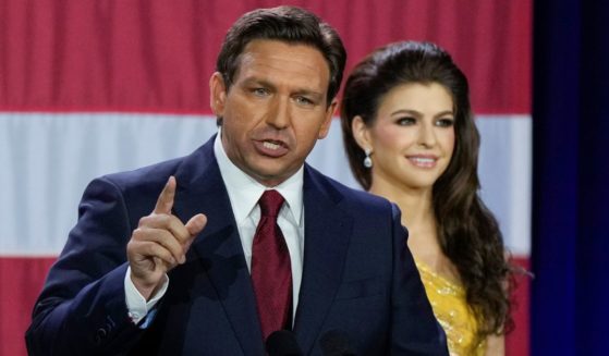 Florida Gov. Ron DeSantis delivers his victory speech Tuesday after cruising to re-election. With him is his wife, Casey.